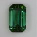 slightly included vivid green emerald cut with open ends.  #822