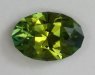 Included, smaller dichroic green oval.  #833