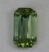 Mildly dichroic, pastel green with a touch of brown, emeral cut.  #842