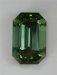 Midium toned, slightly dichroic green, emerald cut.  #864