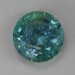Blue, moderate to heavily included cuprian round.  #876