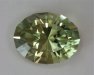 Medium light toned, oval with a yellow color washed with green.  #905