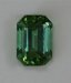 A smaller, dichroic,  emerald cut, that is a bright and vivid green with a couple of small faults under the table.  #906