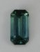 Small non dichroic emerald cut with a bluish cyan color.  #920