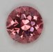 A fine bright medium pink that appears to be eye clean, round  #922