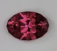 Rich pink or red, this oval with a stepped crown has a  vivid color.  #932