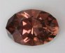 Larger oval with a medium dark, toned, brownish orange color.  #937