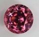 Deeply cut, medium toned, very bright pink, round.