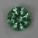 Lightly included vivid mint cuprian round.  #974