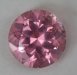 A bright medium pastel pink round that appears to be eye clean.  #975