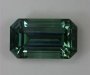 Weakly dichroic and highly transparent, blue green pastel emerald cut.  #979