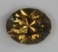 This oval appears to be eye clean and has a smoked yellow color.  #980