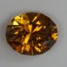 Mildly dichroic with rays of golden orange and yellow, oval  #984