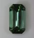 Mildly dichroic, medium toned, highly transparent green emerald cut.  #991