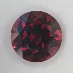 Dark toned brown with shifting pink to orange flash, round  #78