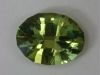 Bright, beautiful yellow green oval with a two step crown.  #51