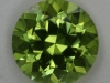 Exceptional yellow green copper bearing round.  #62