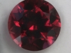 This brown red round's color varies in the amount of brown in it.  #74