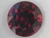 Dark toned brown with shifting pink to orange flash, round  #78