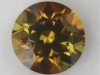 Areas of both dichroic golden yellow and yellowish green face up, round.  #86