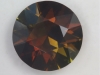 Chocolate brown with a bit of mint, dichroic round.  #88