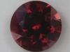 Rich red with a strong brown overtone, round.  #89