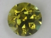 A bright yellow with a wash of green, piece of eye candy, round.  #92