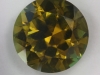 A darker more common, yellow green variety of tourmaline, round  #93