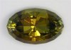 Long ratio, dichroic olive green/yellow, step cut crown, oval.  #1002