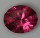 Hot vivid pink oval with a step cut crown.  #1025