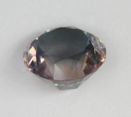 Blue gray and pink round with deep pavilion from the side.