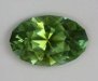 Non dichroic, medium toned bright grass green oval.  #1053