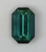 Lightly included, closed ended blue green emerald cut.  #058