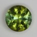 Medium toned, included, acid yellow green roung.  #1064