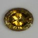 Nice, medium toned yellow, oval with thick step cut crown.  1075