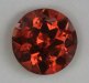 Significantly included, red touched orange, round.  #1096
