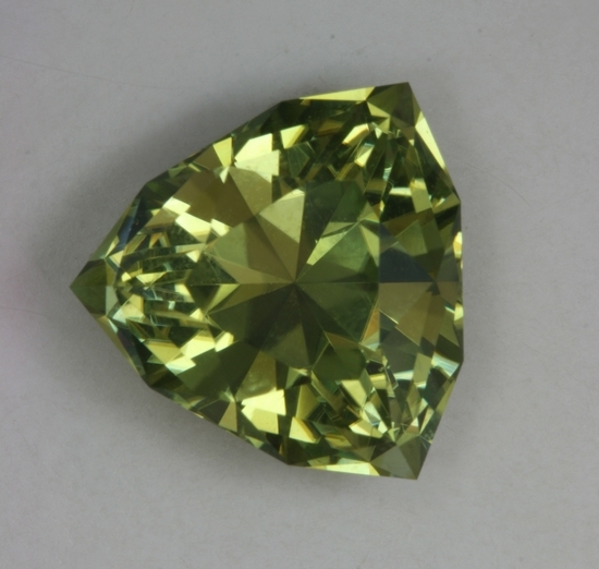 A GEM, exceptional gemstone, yellow green shield cut.