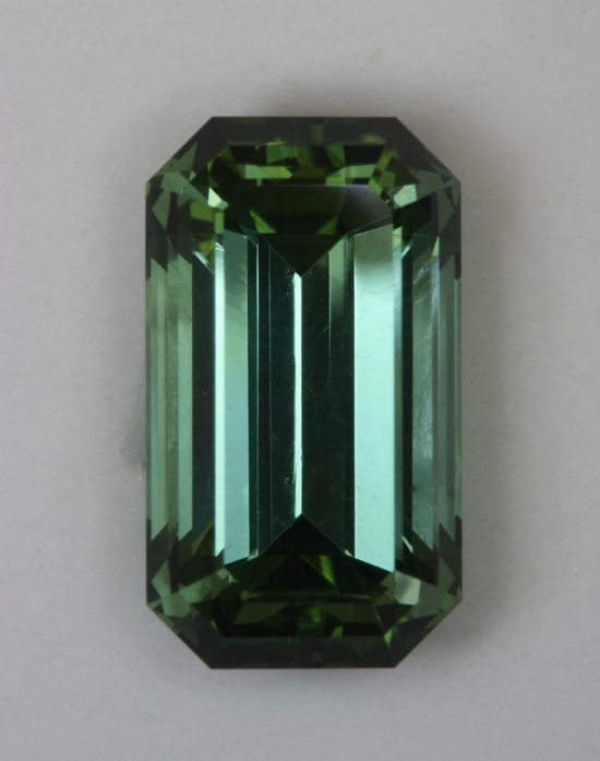 A fine green emerald cut with open ends and fine crystal.