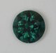 Darker toned blue green with limited flash, round.