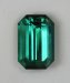 Medium toned, open, blue green emerald cut.