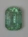 Heavily included minty green emerald cut Brazil