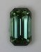 A fine green emerald cut with open ends and fine crystal.