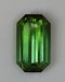 Nice spicy green emerald cut with semi-closed ends.