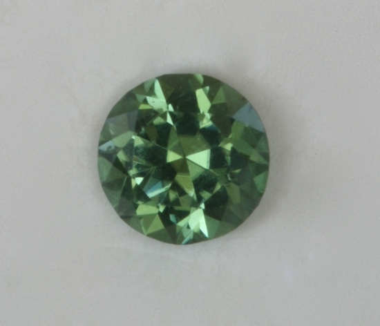 Medium pastel blue green dot of color.