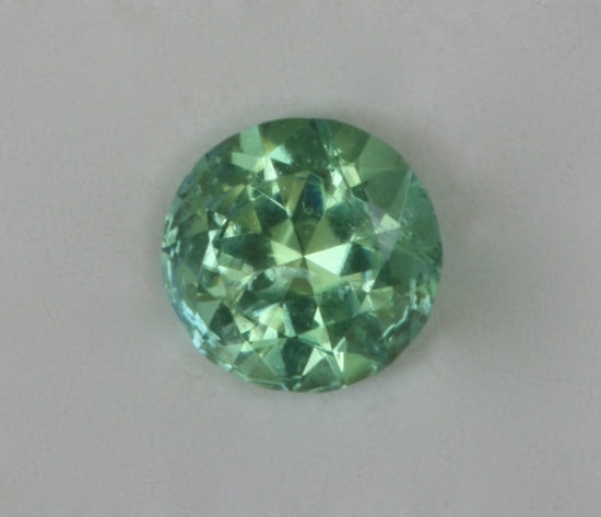 Medium light tone blue green dot of color.