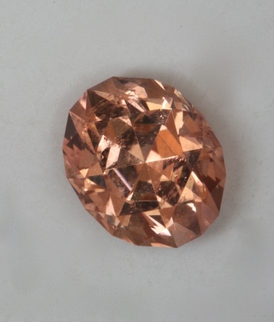 Bright, eye clean, peach pink oval.