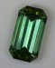 Long ratio, open ended, blue green to yellow green emerald cut.