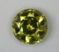 Deaply cut medium toned yellow green round.