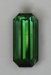 Closed ended, long ratio,spicy green emerald cut.