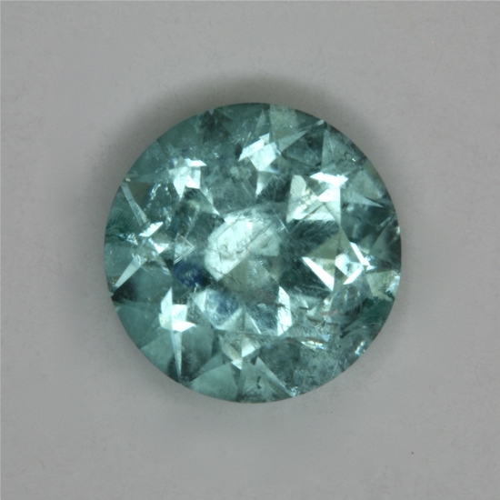 Moderately included, lightly tone pastel blue droplet of color. #111